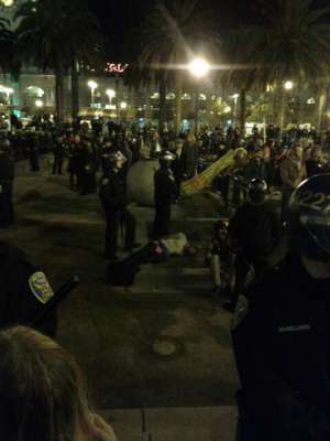 SFPD cops stand around impassively as Chris Jones is lying on the ground shaking