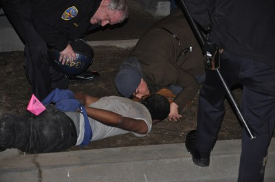 A nurse tries to help Chris Jones, and places something under his head.